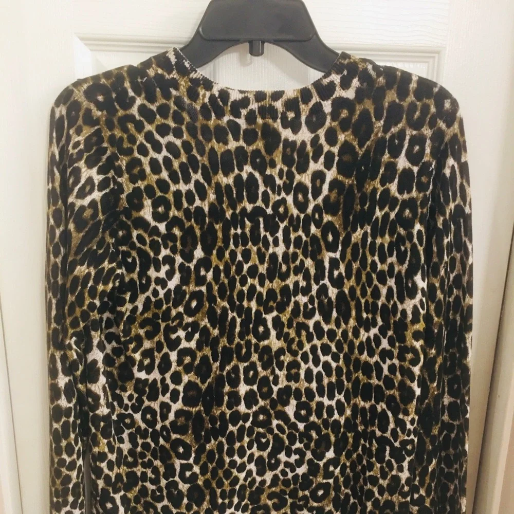 Mk sweater over size will fit a med. cheetha p